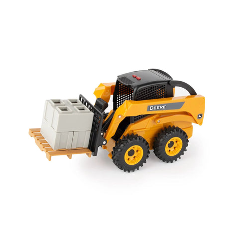 Big Farm Skid Steer Set 1 16 Scale Lights And Sounds Construction Toy with cement blocks on pallet, yellow toy loader