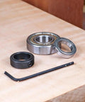 Router Bit Stop Collar Kit With Allen Key, Complete Bearing And Clamp Collar Set, shown on a wooden surface