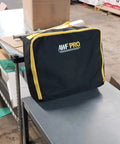 Heavy Duty Portable Spill Kit For Truckers Featuring A Real Deal 31 Piece Cleanup Set in rugged nylon bag on a table.