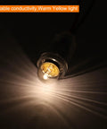 Hella Bright E10 Mini Light Bulbs With Warm Yellow Vibe 10 Pack 1.5V Miniature Screw Bulbs glowing in a dark setting.