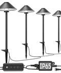 4 Pack Dusk To Dawn Outdoor Pathway Lights With Dimmable LED Landscape Lighting Easy Setup Hands Free Operation IP65 Waterproof Low Voltage Wired With Transformer Timer And Memory Function For Gardens And Walkways showing four black metal lights with wiring and control unit.