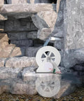 50W Micro Hydroelectric Generator Water Turbine Portable Mini Hydro Power Station for outdoor camping, shown near rocks and water