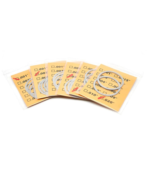 Premium Slick Heavy Duty Barrel Nut Shim Kit With Twenty Badass Precision Pieces For Flawless Rail Alignment and Rock Solid Torque On 556 And 223 Rifles, stainless steel shims in packaging.