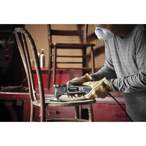 Reconditioned Corded Oscillating Multi Tool Kit Featuring Durable Metal Frame engineered for sharp cutting on a chair.