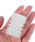 Silicone Sealing Gasket Set With Wave Sleeves, 4 Piece Replacement Kit For Ice Cream Makers, showing single wave sleeve held in hand.