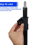 Hand holding a Six Pack Star Knobs 3/8-16 Tpi Female Adapter For T Track Bolts Jig Clamps Quick Install on black pole.