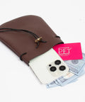 Badass Brown Leather Belt Pouch For Medieval Renaissance And Viking Larp Cosplay holding a phone, cash, and card.