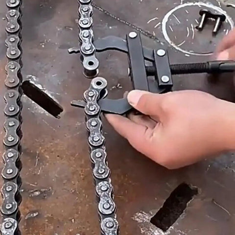 Using Heavy Duty Motorcycle Chain Tensioner Tool large steel tightener on a motorcycle chain for adjustment and alignment.