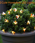 Bee String Lights 2 Pack, 17 Ft Each, 60 LED Copper Wire Fairy Lights wrapped around potted shrub outdoors