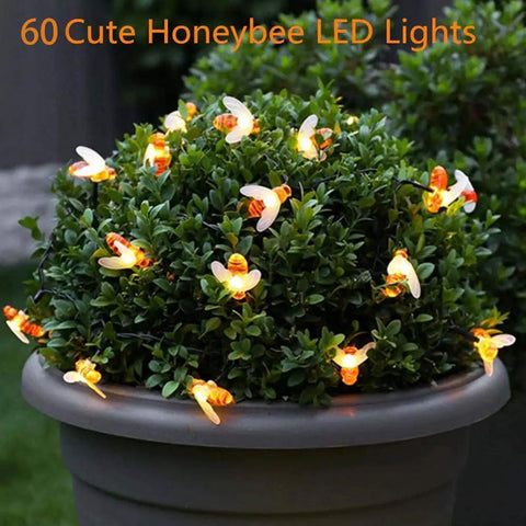 Bee String Lights 2 Pack, 17 Ft Each, 60 LED Copper Wire Fairy Lights wrapped around potted shrub outdoors