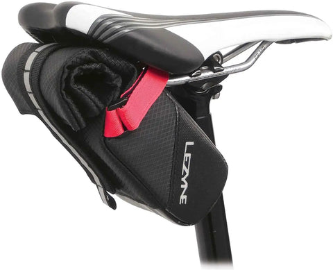 Caddy Sack Medium Waterproof Cycling Pouch Bag with Rolled Velcro Closure attached under a bicycle seat for easy access.