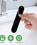 Non Slip Rug Tape 4 Pack being washed under running water, showing its reusable and durable material for hardwood floors and tile