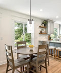 Single Light Sleek Clear Glass Pendant Chandelier In Brushed Nickel Dining Room Pendant Light over a wooden dining table