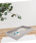 Sleek Three Piece Multi Compartment Jewelry Organizer Tray With Supple Velour Finish For Earrings Rings And Necklaces displaying a necklace in grey velour.