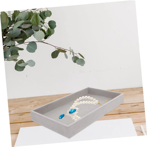 Sleek Three Piece Multi Compartment Jewelry Organizer Tray With Supple Velour Finish For Earrings Rings And Necklaces displaying a necklace in grey velour.