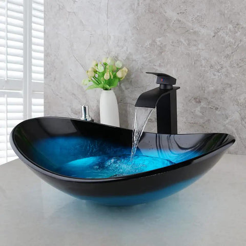 Blue Oval Glass Vessel Sink With Waterfall Faucet And Pop Up Drain Above Counter Bathroom Vessel Sink Artistic Tempered Glass Bowl Modern Dope Boat Shape Design For Stylish Home Renovation