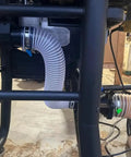 Clear 1-1/2 Inch By 10 Foot Dust Collection Hose with Carbon Steel Wire for Dust Collectors in woodworking setup.