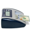 No Sweat Commercial Grade Five Point Automatic Money Bill Detector And Counterfeit Validator With Ultraviolet Magnetic Infrared Watermark Dimension Sensors For Quick Buck Scans And Secure Retail Transactions showing a US hundred dollar bill being fed into the device.