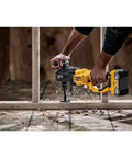 Boss Level 20V Max Brushless Compact Stud And Joist Drill With No Sweat Quick Change Chuck drilling through wood beams on job site.