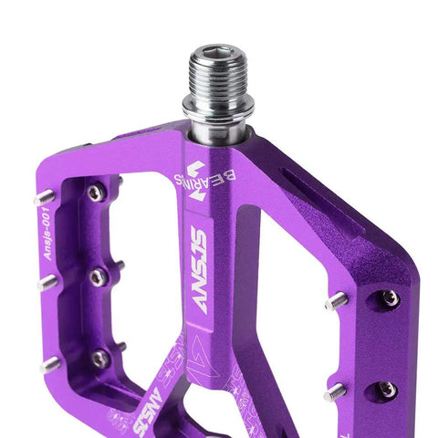 Close-up of Grippy Aluminum Flat Pedals With Ultra Traction Pins And Sealed Bearings, Lightweight Purple Platform Pedals, 9/16 Inch Spindle