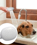 Portable Shampoo Sprayer For Round Faucets With Rubber Hose used for pet grooming in sink, detailed nozzle view.
