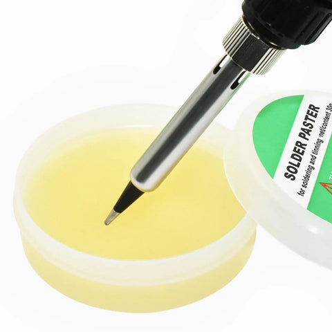 Soldering iron tip dipping into Pro Grade Soldering Paste And Cream For Electronics Repairs PCB And LED Soldering Easy To Use Welding Cream