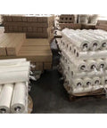 Fast Dry Dye Sublimation Paper Roll 95gsm 24x164ft for heat transfer printing stacked in warehouse, 2-inch core visible