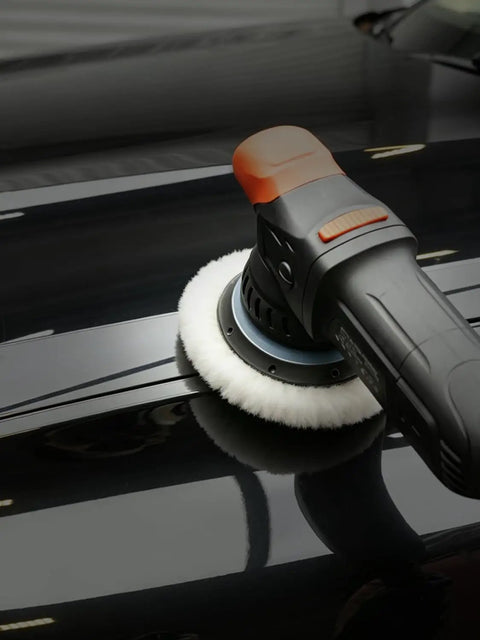 Car polisher using a Wool Buffing Polishing Pads Set For 6 Inch Car Polisher, 3 Pack (150mm) for a mirror finish.