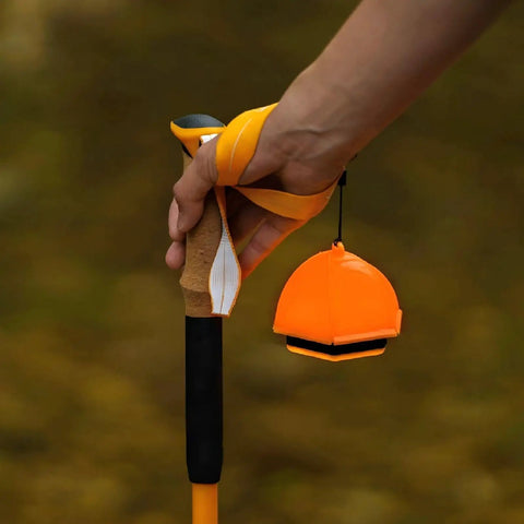 Hand holding orange waterproof portable 2-In-1 Camping Light And Tent Lantern For Outdoor Adventures