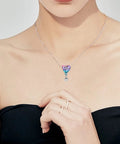 Woman wearing Hot Air Balloon Happy Birthday Dangle Charm In 925 Sterling Silver With Pink Purple And Blue Enamel necklace.