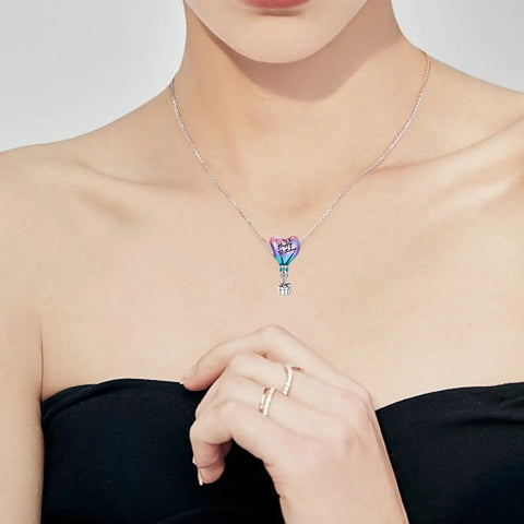 Woman wearing Hot Air Balloon Happy Birthday Dangle Charm In 925 Sterling Silver With Pink Purple And Blue Enamel necklace.