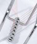 7 Ball Newton's Cradle Pendulum Desk Toy With Classic Swing And 30 Plus Second Swing Time, Chrome Iron Construction on desk