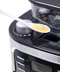 Solid Bean To Cup Coffee Machine Automatic Espresso Brewer Cranks Out 11 To 15 Cups, adding sugar to the grinder.