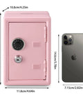 Mini Money Safe Lock Box For Cash, Jewelry And Valuables, Durable Steel Security Safe Pink Portable Safe 4.6 x 4.2 x 6.9 Inches next to a smartphone for size comparison.