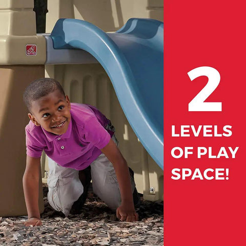Child playing under slide of Tot Friendly Outdoor Kids Playset With Two Tier Swing Set, Slide, Climber, Crawl Space And Playhouse