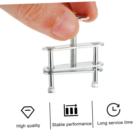 Close-up of hand holding 10 Pack Adjustable Screw Water Stopper Clamp For Lab Tubing Control Clips And Brackets, silver