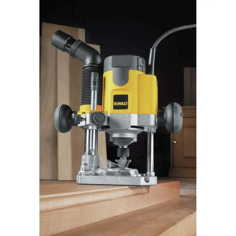 Pro Grade Workhorse Two Horsepower Plunge Router With Slick Ten Amp Electronic Variable Speed Motor in action trimming wood.