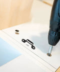 100 Piece Invisible Connector Screws Zero Drama Hidden Furniture Fasteners used with a power drill for cabinet assembly.