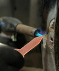 Close-up of dent repair using Dent Pulling Rings Panel Welder Tool Kit With Iron Shaping Tabs for automotive sheet metal repair.