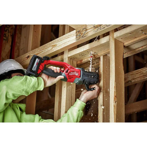 Worker using Beast Mode Brushless M18 FUEL Hole Hawg Half Inch Cordless Right Angle Drill Tool Only For Tight Spaces And Heavy Duty Drilling Power Built For Pros With All Day Comfort Red And Black in a wooden frame