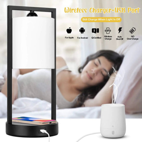 Wireless Charging Table Lamp with USB Port and White Fabric Shade, shown beside a relaxing woman, smartphone charging