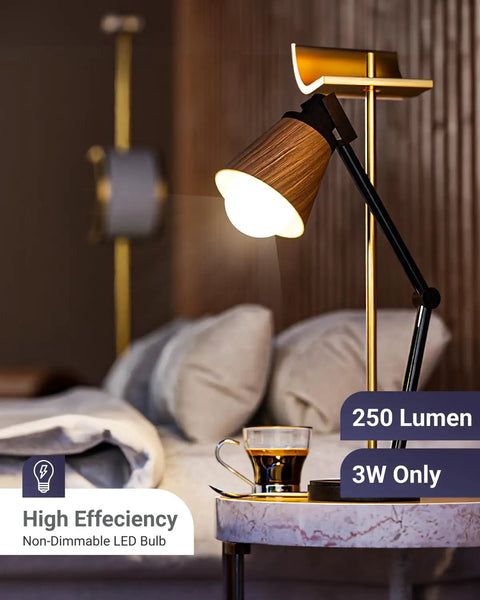 Table lamp with 250 lumen bulb illuminating a cozy bedroom setting. High efficiency non-dimmable LED in use.