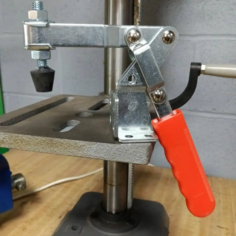 Heavy Hitter Vertical Toggle Clamp 10 Pack Set delivering 225 lb clamping force with red handle on a workbench.