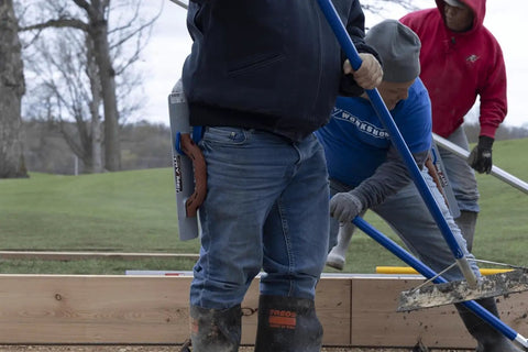 Workhorse Tool Hook And Trowel Hanger A Dependable Hand Tool Carrier on tool belt, holding masonry tools on job site.