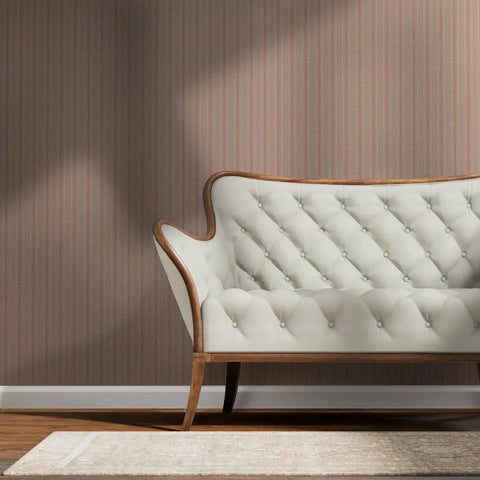 Fresh Peach Floral Stripe and Silver Metallic Wallpaper Bring Sick Textured Vibes to Any Room with This Eco Friendly Paste The Wall Accent Covering Made in USA and Completely PVC Free, displayed behind a cream tufted couch.