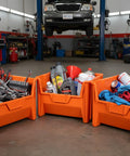 54 Pack Heavy Duty Plastic Stackable Hopper Bins 20 By 15 By 12 In Orange Industrial Bulk Storage Containers With Tough Grip Handles holding tools and chemicals in a garage.