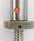 Close-up of SFU1204 ball screw with RM1204 nut, 12 mm diameter, silver metal.
