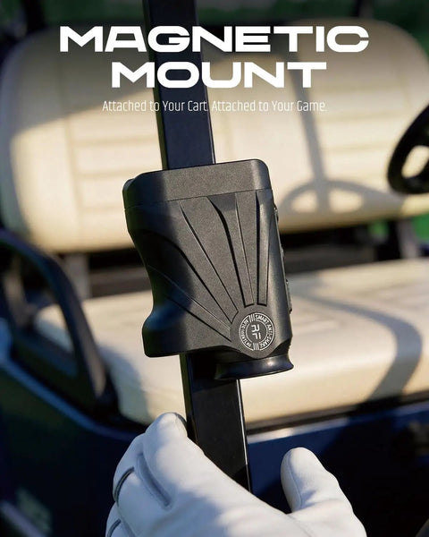 Golf Rangefinder With Slope And Magnetic Stripe attached to cart bar, shown with gloved hand in golf cart