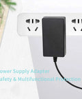 Power Up Your Gear With A 15V 2A DC Power Supply Charger Adapter, 100-240V Input, 30W Output plugged into wall outlet