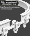 Close-up of a white Heavy Duty Double Curtain Track System With Silent Roller Curved Ceiling Rail showing rollers and smooth bendable rail.